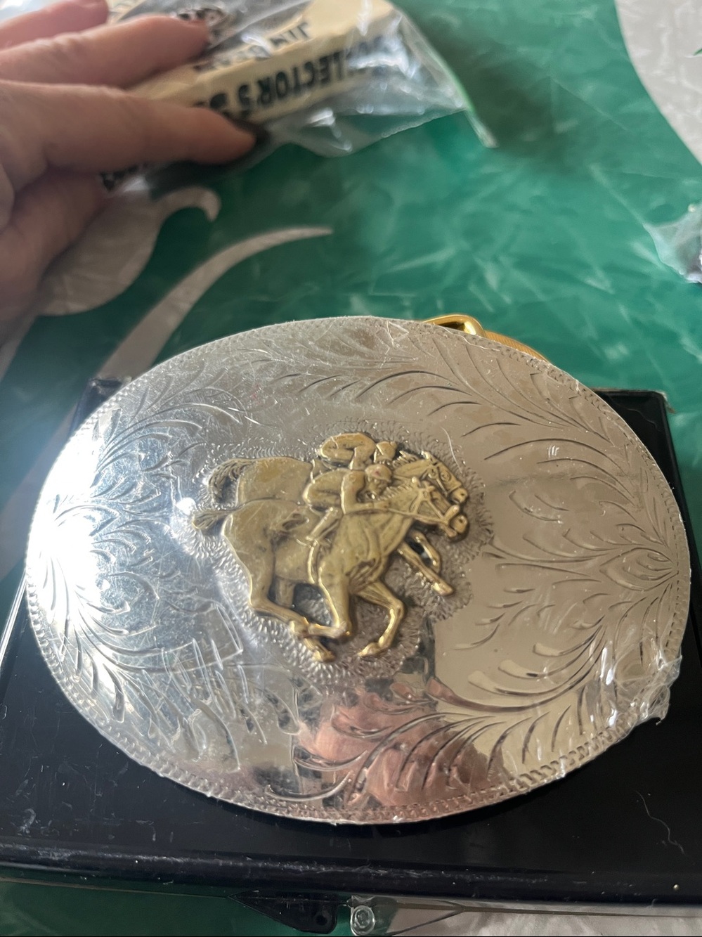 New in plastic silver plated jockeys belt buckle